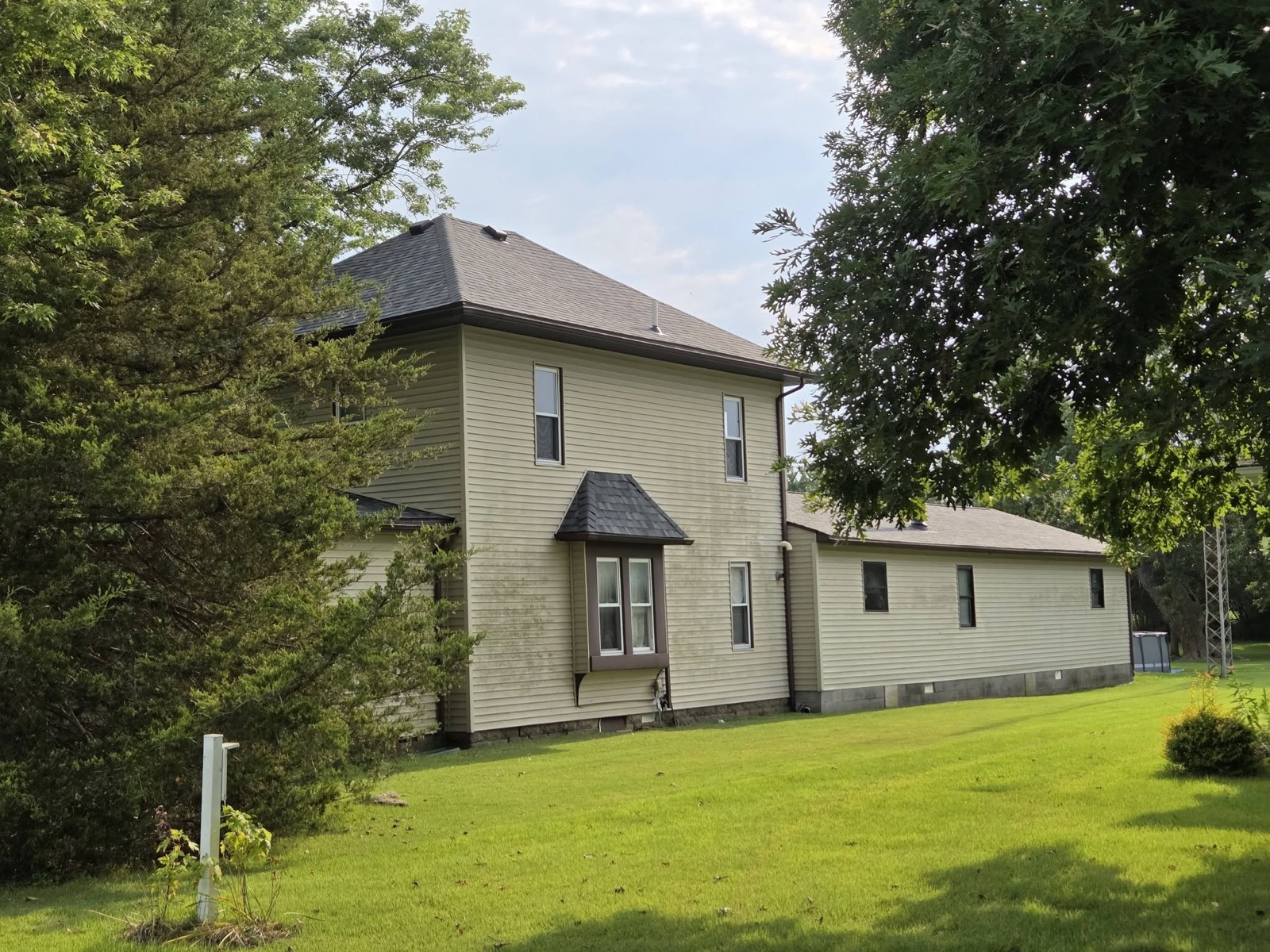 Two-story home with a newly installed roof